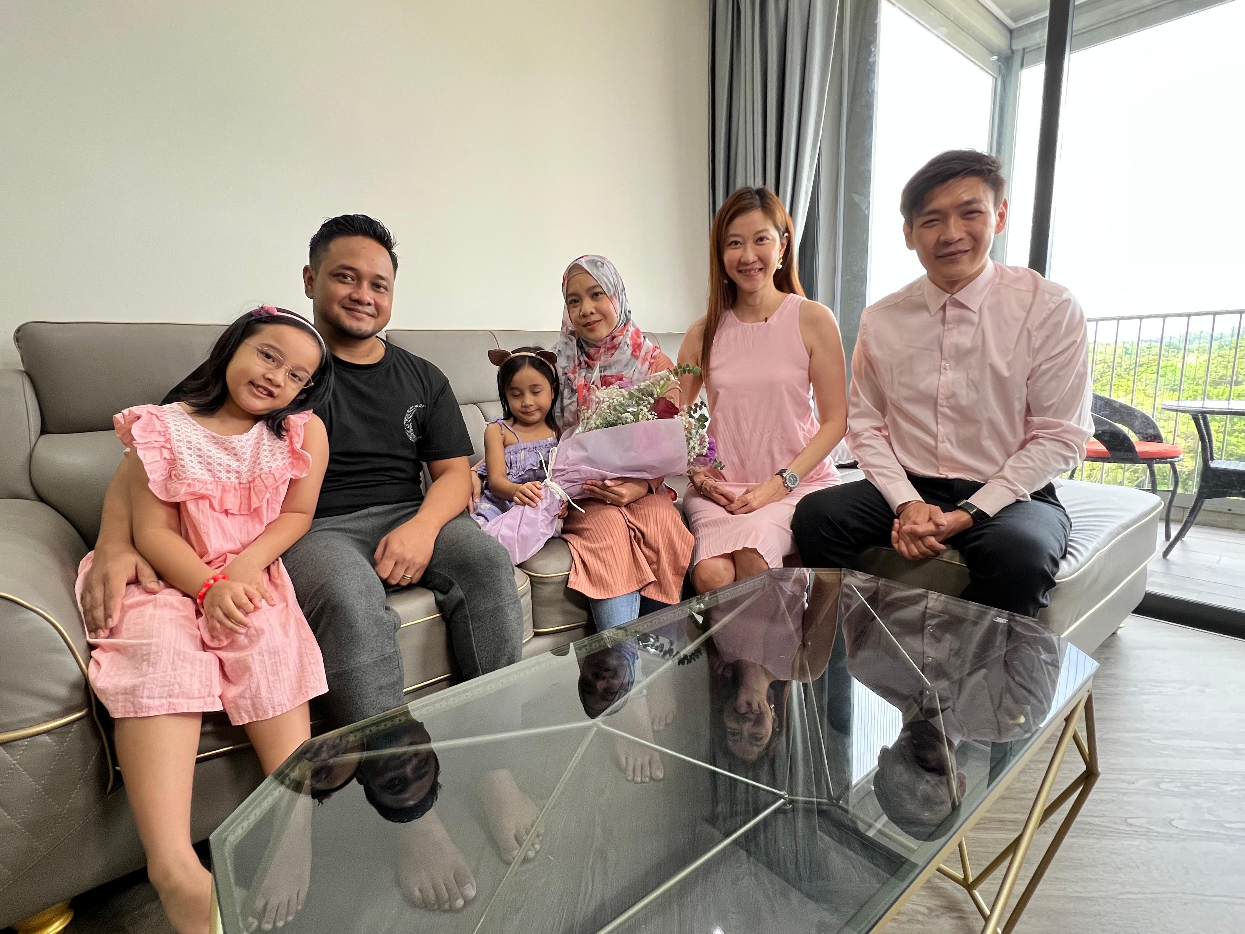 Kelly and Mark Yu with satisfied client