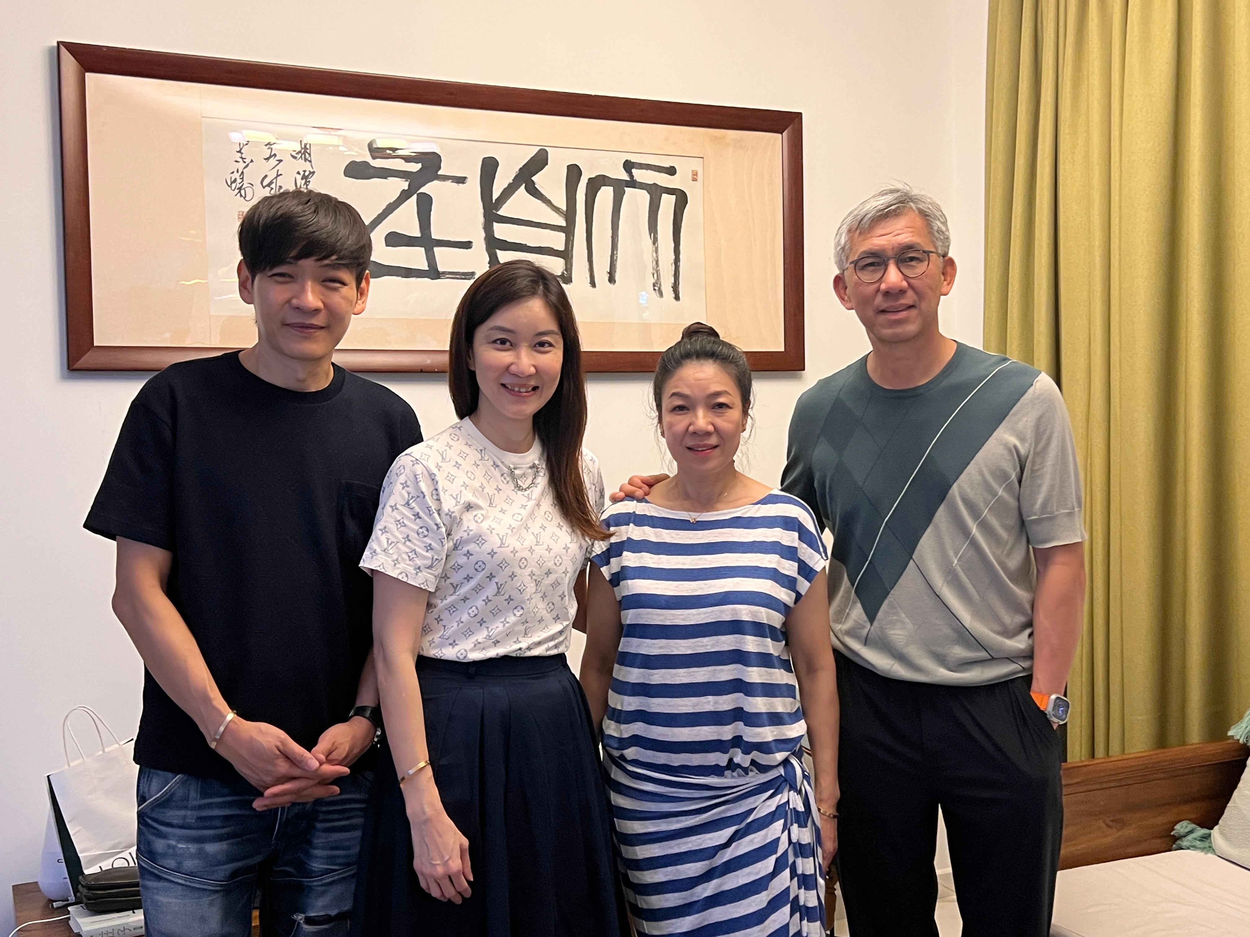 Kelly and Mark Yu with satisfied client
